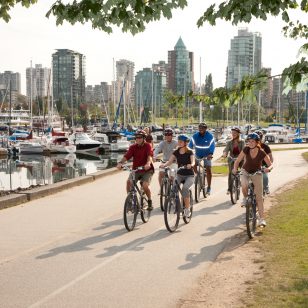 A group of cyclists on the seawall in Vancouver's Stanley Park.