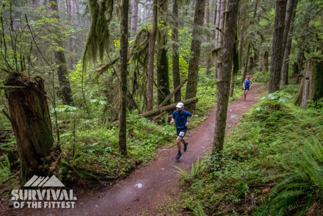 Runners on a forested trail in Squamish, BC during the Survival of the Fittest trail running race