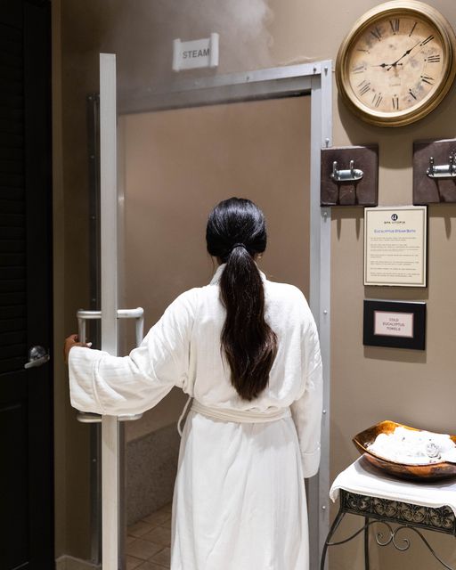 Girl in robe opening door at Spa Utopia retreat in Vancouver