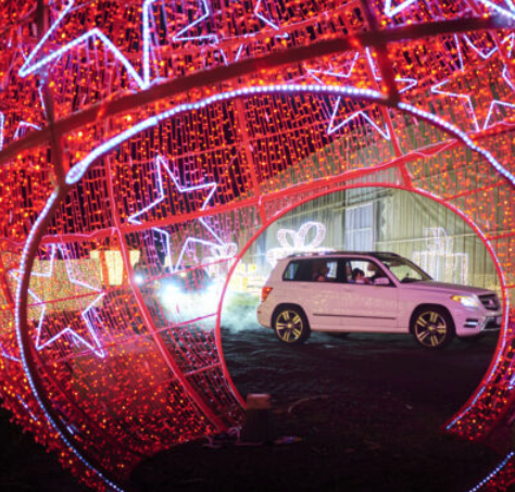 A car drives through Glow Gardens Langley