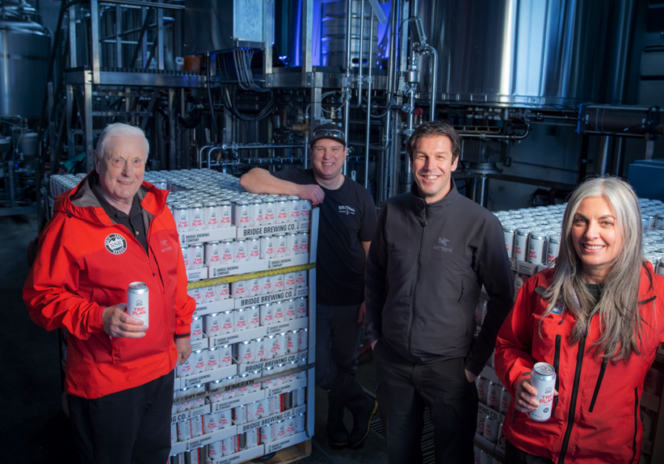 Members of North Shore Rescue pose with Bridge Brewing Trip Plan IPA