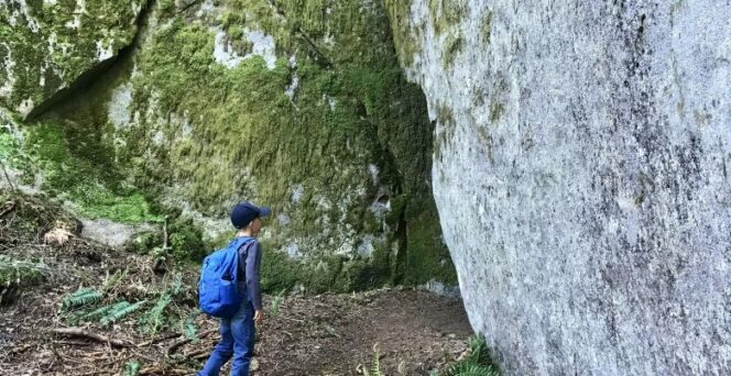 A child explores the Stone Garden along the Dragon's Back Trail in Hope