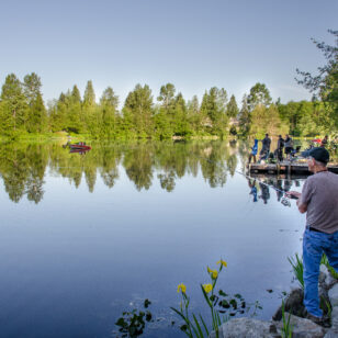 A man fishes at Como Lake Park in Coquitlam