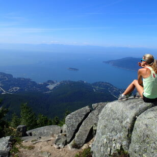 A hiker enjoys the view at Eagle Bluff