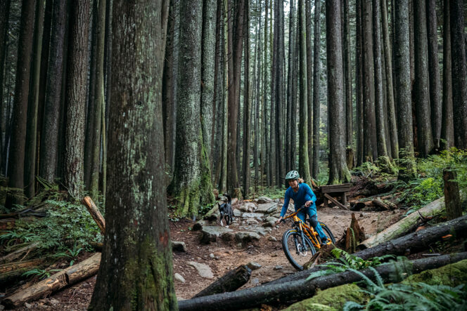 Betty Birrell rides her mountain bike through the forest in North Vancouver in a still from the film, North Shore Betty.