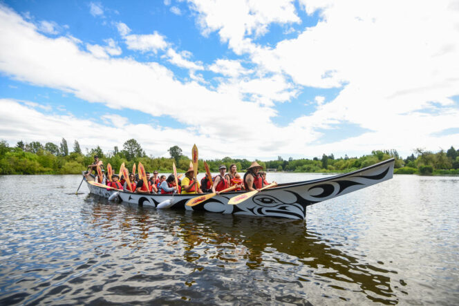 Paddlers in a First Nations Canoe