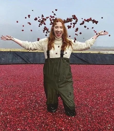 A woman poses in a flooded cranberry bog near Vancouver