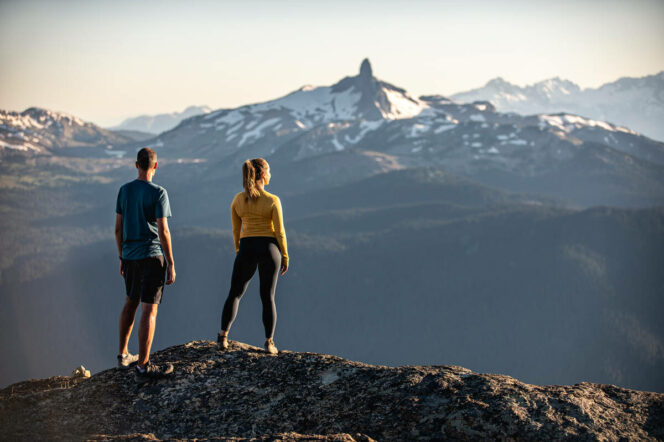 Two hikers look at Black Tusk Peak from Whistler Mountain