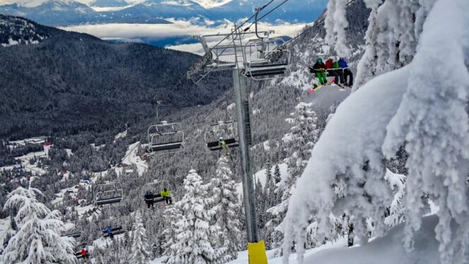 Skiers ride the chairlift at Sasquatch Mountain Resort. 