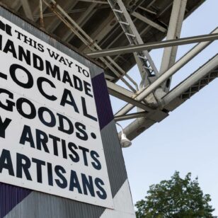 A sign on Granville Island promoting lcoal artists
