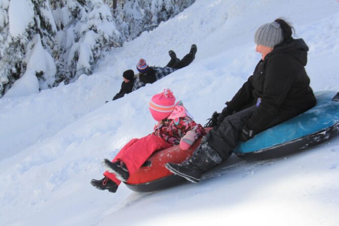 A mom and daughter enjoy the Polar Coaster Tube Park and Manning Park