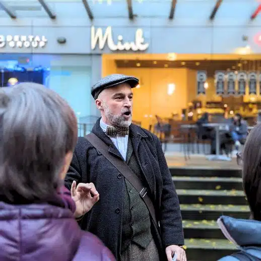 A guide leads a Forbidden Vancouver tour