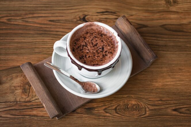A mug of hot chocolate on a tray.