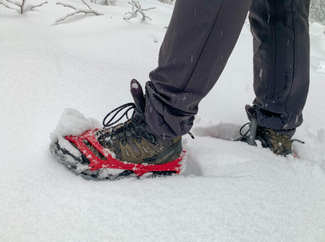 A hiker wearing microspikes in the snow